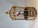 A stunning and very fine  Hexagonal  shaped, gilt bronze and Sevres plaque single singing bird-in-cage, by Bontems