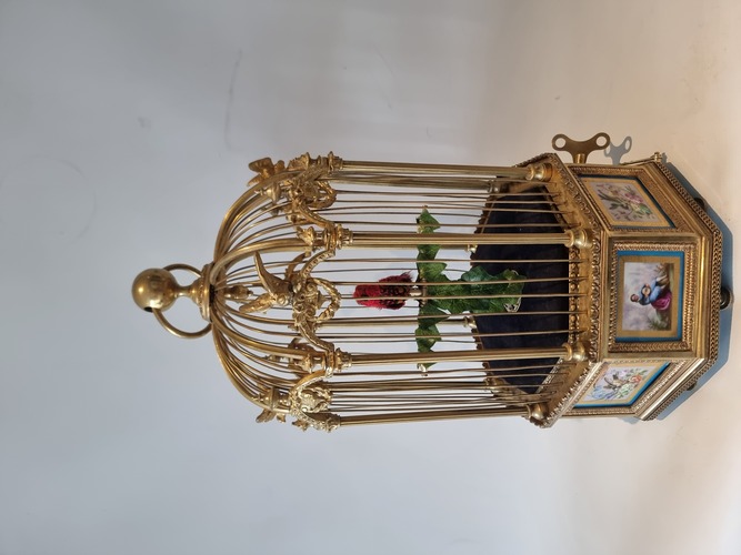 A stunning and very fine  Hexagonal  shaped, gilt bronze and Sevres plaque single singing bird-in-cage, by Bontems