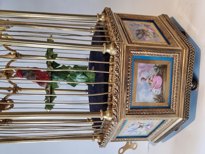 A stunning and very fine  Hexagonal  shaped, gilt bronze and Sevres plaque single singing bird-in-cage, by Bontems