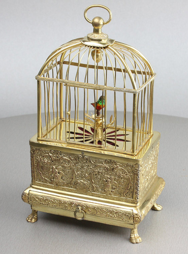 Vintage miniature gilt brass singing bird in cage, by Eschle